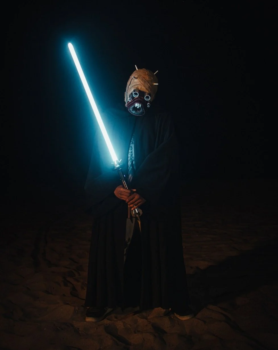Illuminated blue lightsaber at night